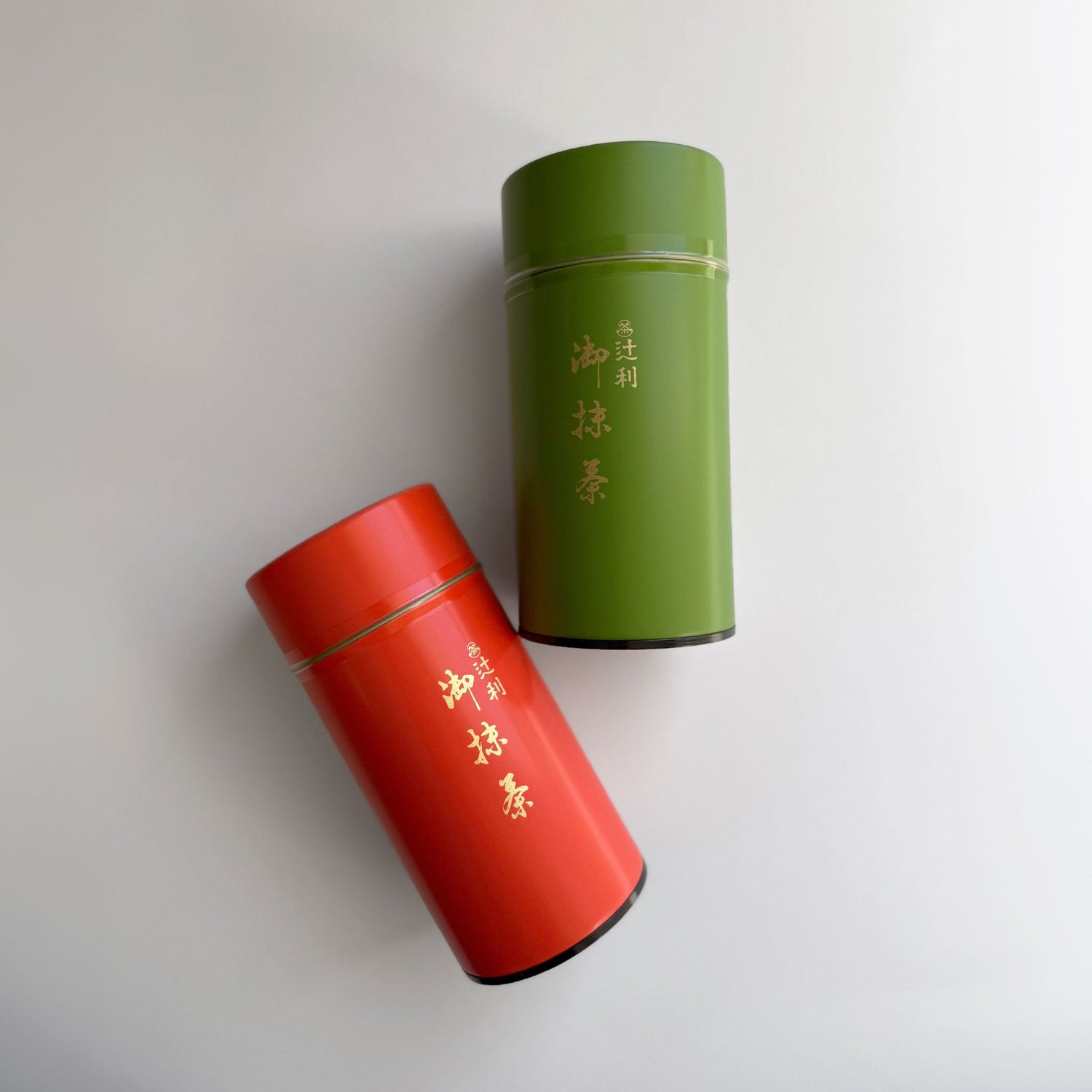 Vibrant green Japanese ceremonial matcha powder scattered on a white background