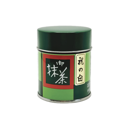 Green colored Matcha canister with Japanese text on a white background