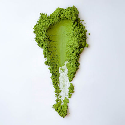 A swatch of Zuhio matcha powder on a white background 