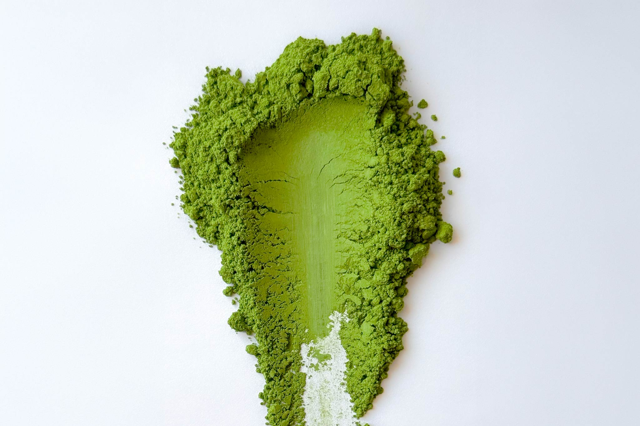 Matcha powder swatch on a white background